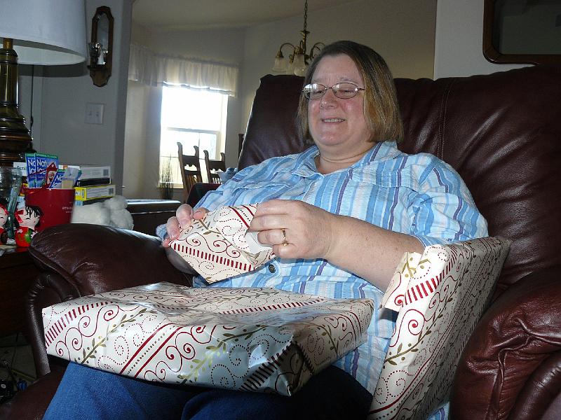 P1010064.JPG - Lyn, surrounded with gifts.