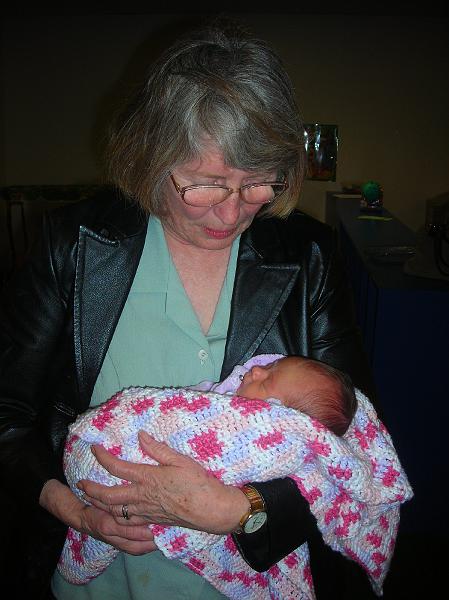 Feb1311.JPG - A visit to AWANA and Lois gets a chance to hold Hailee