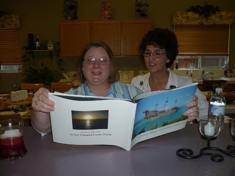 P1000499.JPG - Chris shows Lyn a photo album.