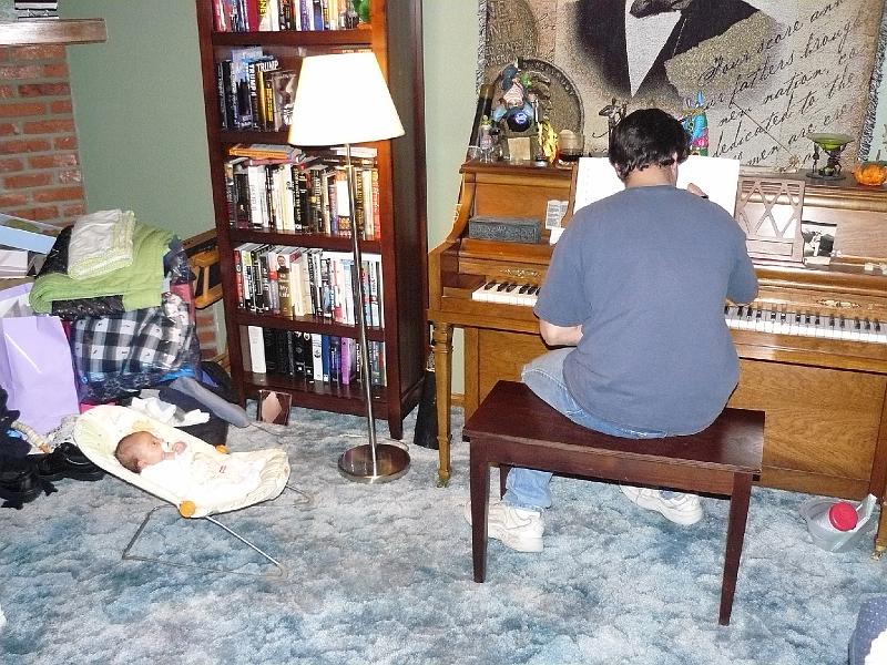 P1010585.JPG - Listening to Daddy writing a song.