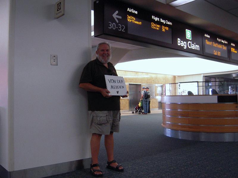 DSCN1365.JPG - Our tour guide is waiting for us when we arrived.  Actually, when we arrived there were 4 other drivers with signs waiting with Bob at the bottom of the escalator.