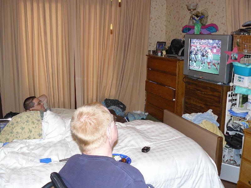 P1010359.JPG - Kasey and Larry watching the game